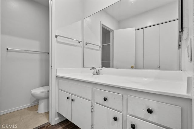 bathroom featuring toilet and vanity