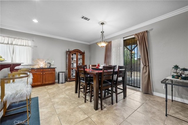 tiled dining room with crown molding