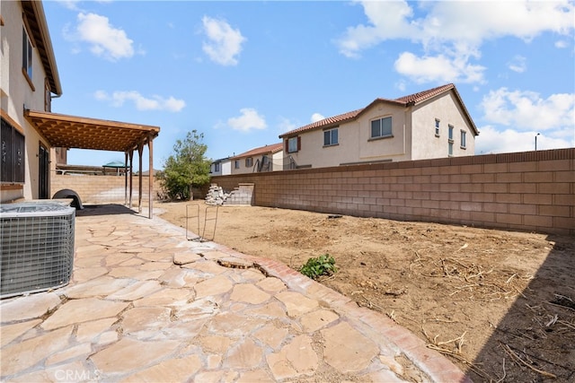 view of yard with a patio area and central air condition unit