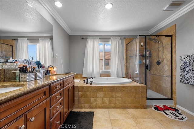 bathroom featuring vanity, shower with separate bathtub, ornamental molding, and a textured ceiling