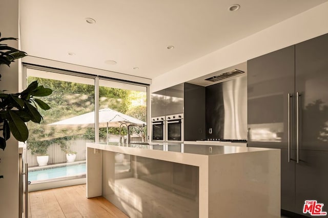 kitchen featuring light hardwood / wood-style floors and stainless steel oven