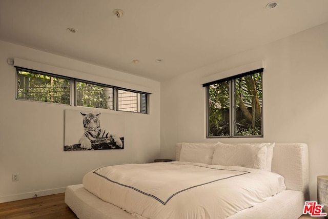 bedroom featuring hardwood / wood-style flooring