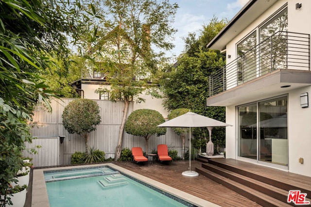 view of pool with a wooden deck