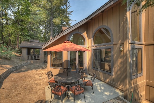 rear view of property featuring a patio