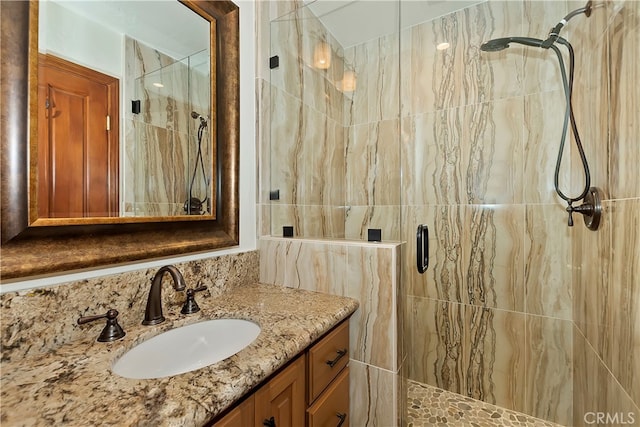 bathroom with vanity and an enclosed shower