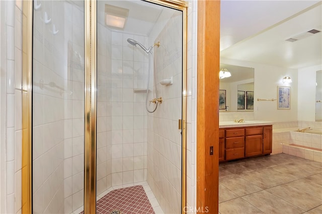 bathroom with vanity, tile patterned flooring, and an enclosed shower