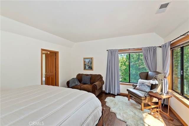 bedroom featuring vaulted ceiling and hardwood / wood-style floors