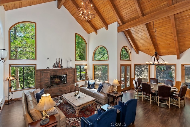 living room featuring dark hardwood / wood-style flooring, high vaulted ceiling, and a healthy amount of sunlight