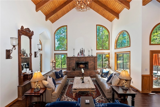 living room with high vaulted ceiling, dark hardwood / wood-style floors, and plenty of natural light