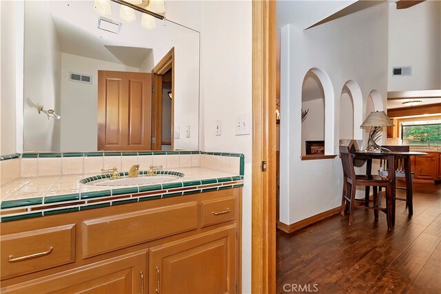 bathroom featuring vanity and hardwood / wood-style floors