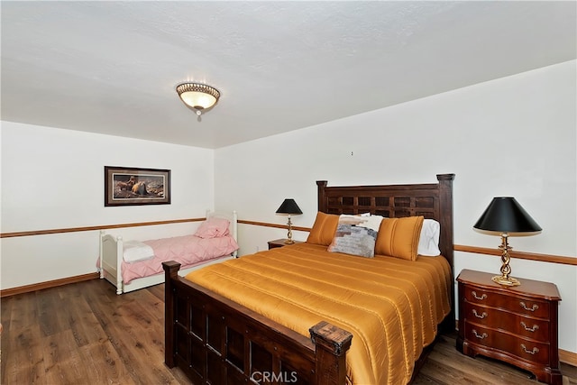 bedroom featuring dark hardwood / wood-style floors