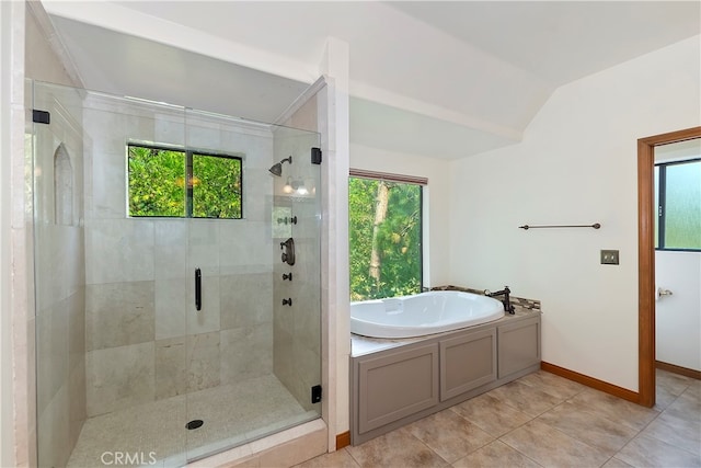 bathroom featuring shower with separate bathtub, tile patterned flooring, and vaulted ceiling