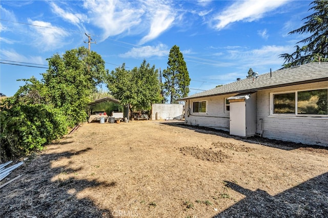 view of yard with a carport