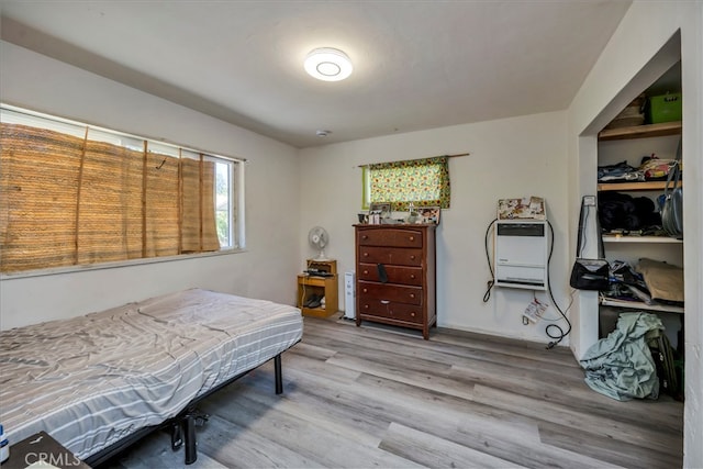 bedroom with light hardwood / wood-style flooring