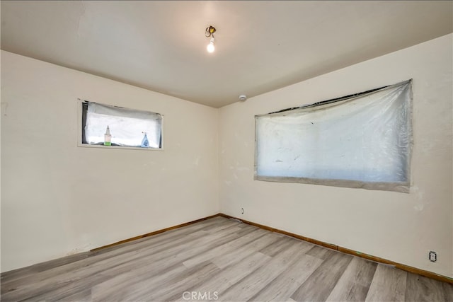 spare room with light wood-type flooring