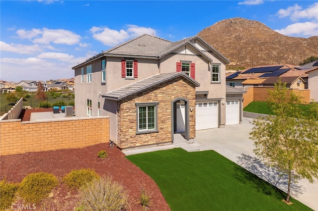 front of property with a mountain view and a front yard