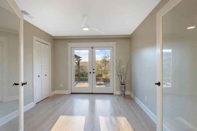 doorway to outside with ceiling fan, light hardwood / wood-style floors, and french doors