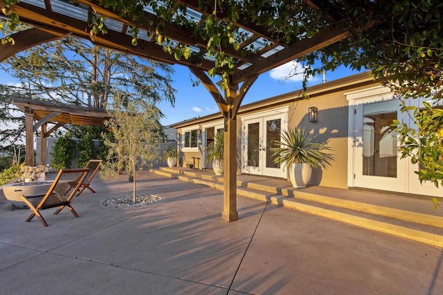 view of patio with a pergola and french doors