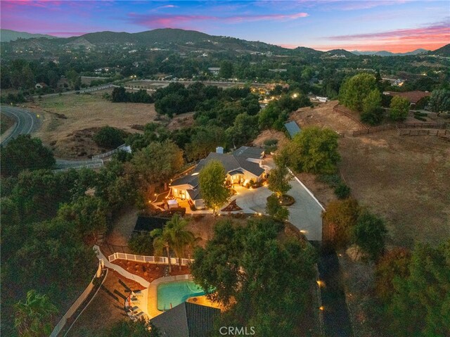 aerial view at dusk with a mountain view