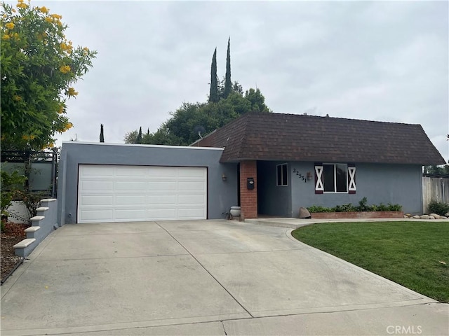 view of front of house with a garage and a front yard