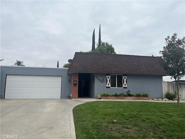 ranch-style house featuring a garage and a front yard