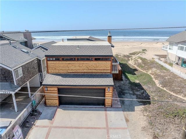 drone / aerial view with a view of the beach and a water view