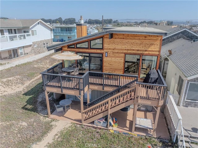 1612 Strand, Oceano, CA 93445 - back of house featuring a deck, stairs, and a chimney