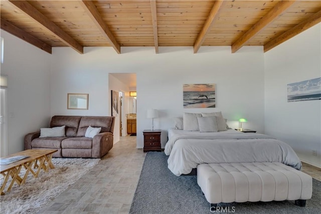 bedroom with wood ceiling, connected bathroom, and beam ceiling