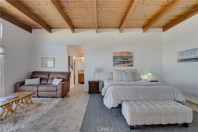 bedroom with beamed ceiling, connected bathroom, and wood ceiling