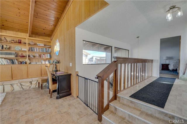 staircase with lofted ceiling, wood ceiling, and built in shelves