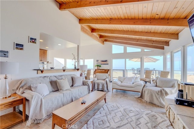 living room featuring beamed ceiling, high vaulted ceiling, and wooden ceiling