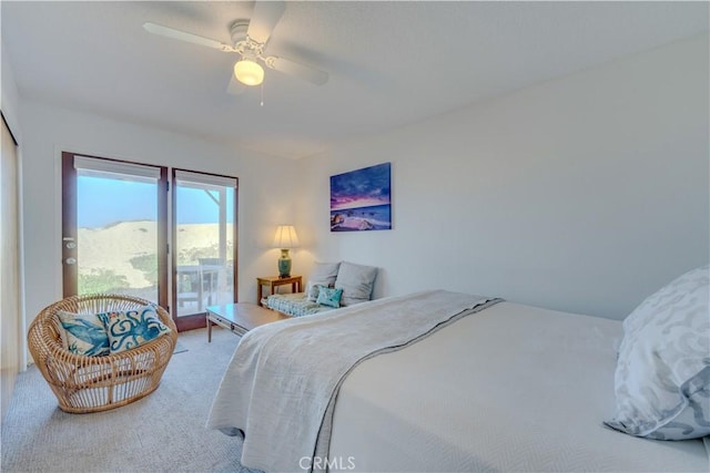 carpeted bedroom with ceiling fan and access to outside