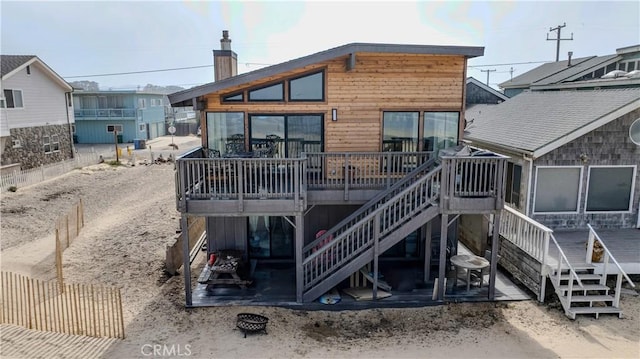 1612 Strand, Oceano, CA 93445 - back of property featuring stairs, a wooden deck, and a chimney
