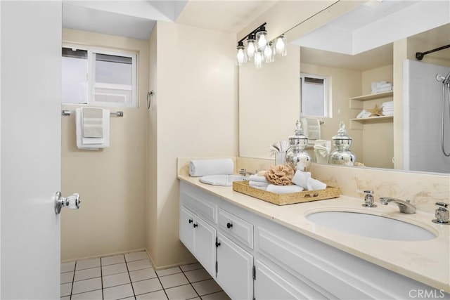 bathroom featuring a shower, tile patterned floors, and vanity