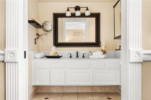 bathroom with tile patterned floors and vanity