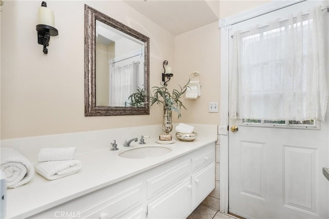 bathroom with vanity and tile patterned flooring