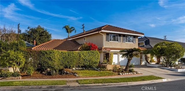 mediterranean / spanish-style house featuring a garage