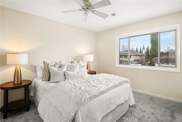 bedroom with ceiling fan and carpet flooring