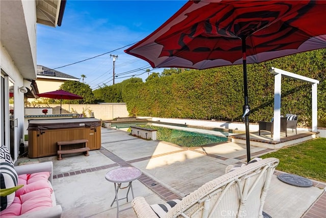 view of patio featuring a hot tub