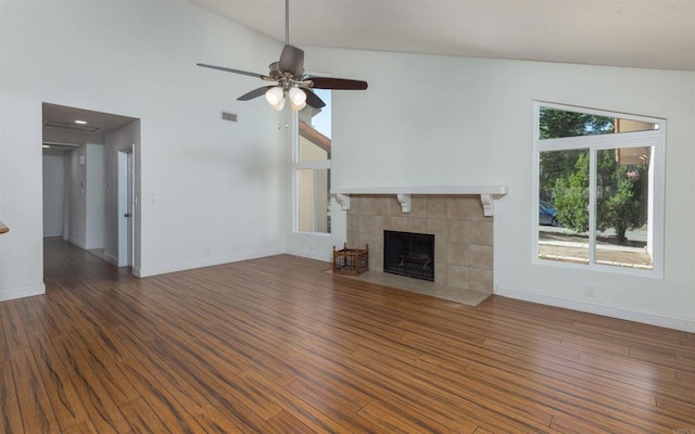 unfurnished living room with a fireplace, wood finished floors, and visible vents