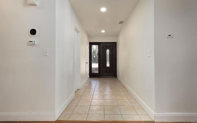 entryway featuring recessed lighting, visible vents, baseboards, and light tile patterned floors