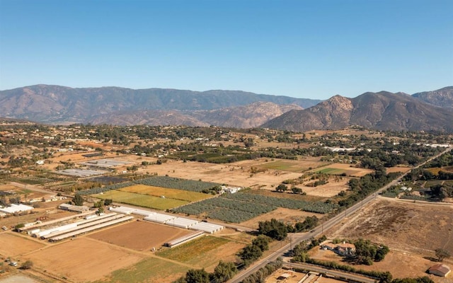 drone / aerial view featuring a rural view and a mountain view