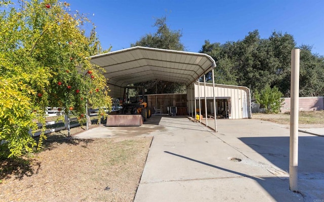 view of parking / parking lot featuring a detached carport