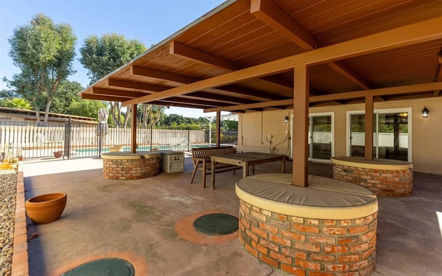 view of patio / terrace featuring a fenced in pool and fence