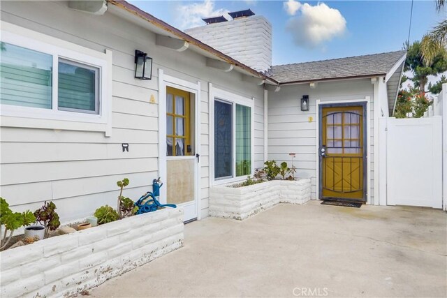 entrance to property with a patio