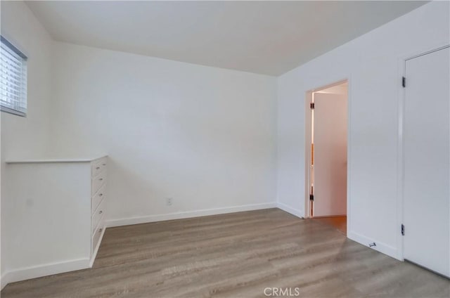 unfurnished room featuring light hardwood / wood-style floors