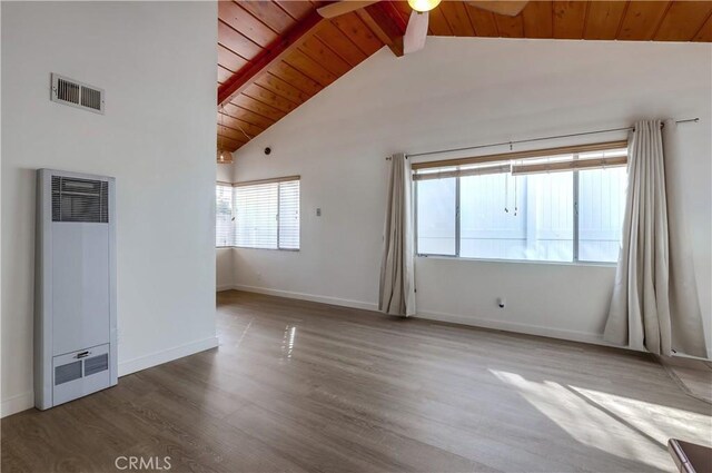 spare room with wood-type flooring, high vaulted ceiling, wooden ceiling, ceiling fan, and beam ceiling