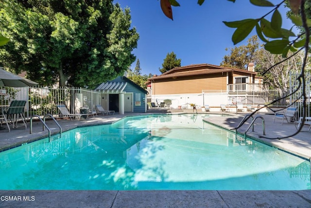 view of swimming pool featuring a patio area