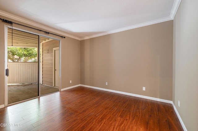 unfurnished room with crown molding and hardwood / wood-style floors