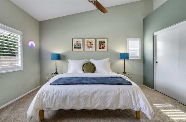 carpeted bedroom featuring baseboards